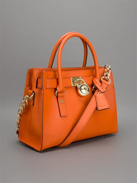 michael kors orange purses.